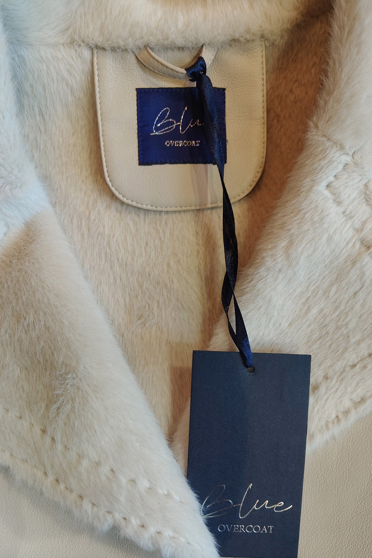 Trench lungo con eco pelliccia